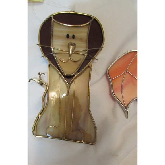 Stained glass leaves and lion handmade ornaments hang in window - Picture 2 of 7